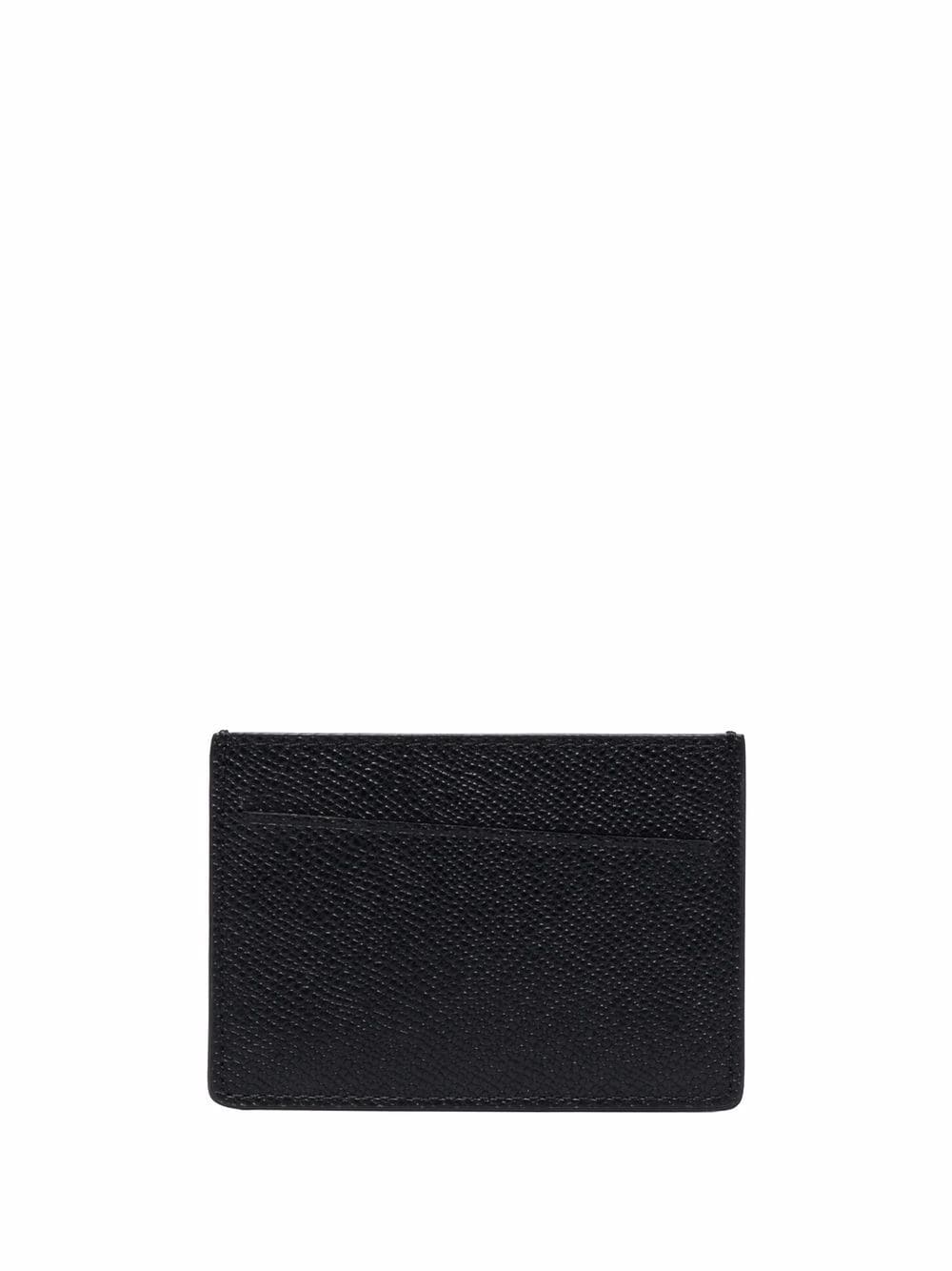 Elegant Italian leather card holder from a side view, ideal for travel and daily use.